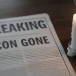 Championship Linebacker DEAD —Fans Devastated… A newspaper with the headline 'BREAKING ICON GONE' next to a lit candle