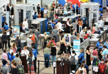 CDC’s Ebola Travel Ban Sparks FURY – Does It Work? Crowd at an airport security checkpoint with TSA officers.