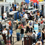 DHS Threatens CHAOS at Sanctuary Airports… Crowd at an airport security checkpoint with TSA officers.