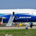 11 Killed on GROUND—Terrifying Jet CRASH Details Boeing 787 airplane at an airport with passengers boarding