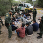 Special Interest Aliens Detained: Security ALERT…. Border patrol agents detaining a group of immigrants.