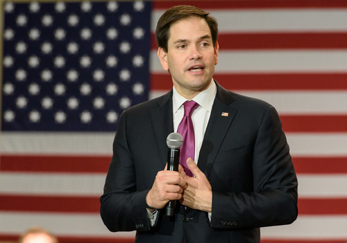 Columbia,,South,Carolina,-,February,10,,2016:,Presidential,Candidate,Marco A politician speaking into a microphone in front of an American flag