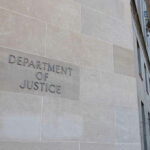 DOJ Targets Alleged Europe-to-U.S. Terror Web Department of Justice building with American flags outside.