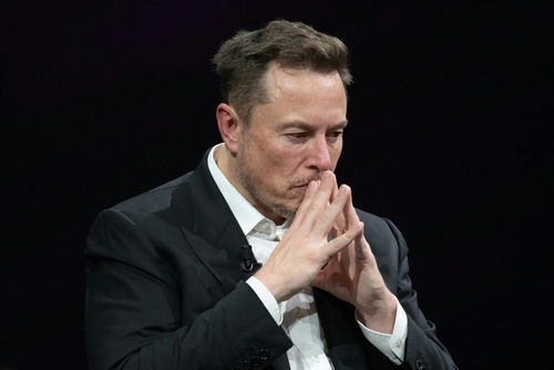 shutterstock2318800313-2jpg Man in suit deep in thought.