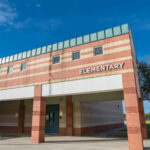Watermelon Apology Exposes Bigger Failure Exterior of an elementary school building.