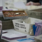 Needle Panic Grips France Workers handling mail-in ballots at a postal service.