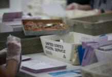 Needle Panic Grips France Workers handling mail-in ballots at a postal service.