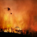 Utah Inferno Explodes, Zero Control Helicopter dropping water on large forest fire.