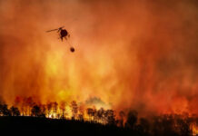 Utah Inferno Explodes, Zero Control Helicopter dropping water on large forest fire.