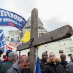 FIFA Prize, Border Backlash Collide Protesters with Trump flag and cross outside the Capitol building.