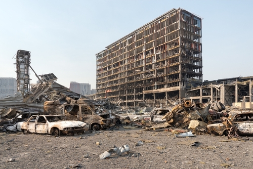 2022,Russian,Invasion,Of,Ukraine,War,Torn,City,Destroyed,Car A devastated urban landscape featuring a burnt building and wrecked cars