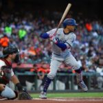 MLB Backtracks—Faith Put On Ice A baseball player from the Dodgers prepares to bat while the catcher is in position