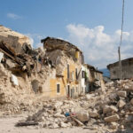 Ceasefire Cracks: Nabatiyeh Blows Up Rubble from collapsed buildings in earthquake-hit area. Clear sky.
