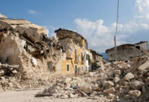 Ceasefire Cracks: Nabatiyeh Blows Up Rubble from collapsed buildings in earthquake-hit area. Clear sky.