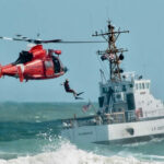 Marine Vanishes At Sea — Chaos Erupts Coast Guard training with helicopter and boat in rough seas.