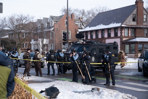 Minneapolis,,Minnesota,,United,States,,07.01.2026,Law,Enforcement,On,Site,After Police officers at a crime scene with a tactical vehicle in a snowy urban area