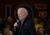 Carville Torches Biden: ‘Tragic’ Meltdown Man speaking into microphone at crowded event.
