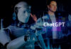 Humanoid robot typing with holographic interface and ChatGPT text overlay