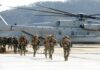 Iran’s Chilling Boast: Nowhere Is Safe Soldiers disembark and walk past a large military helicopter