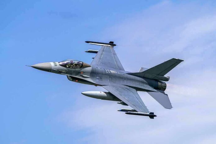 shutterstock_1629356173 Fighter jet banking in the sky