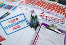 Inside Trump’s War Room Voter registration table with forms, pens, and informational materials