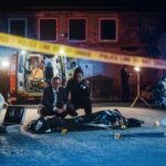 FBI Vault Blackout After Trump Shooting Police and forensic team investigating a crime scene in a dark alley