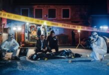 FBI Vault Blackout After Trump Shooting Police and forensic team investigating a crime scene in a dark alley