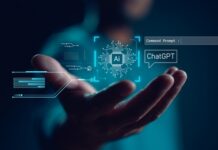 Musk’s AI Whiplash: Enforcer Or Enabler? A hand reaching out with digital elements representing AI and ChatGPT