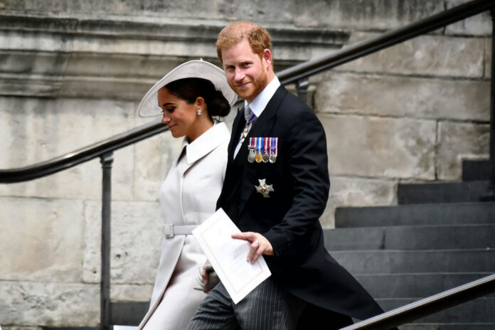shutterstock_2362933217 prince harry walking down outdoor stairs together