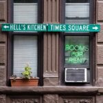Con Ed Uniform, Door Kick-In, Brooklyn Chaos Apartment facade with windows, neon sign, and street direction sign